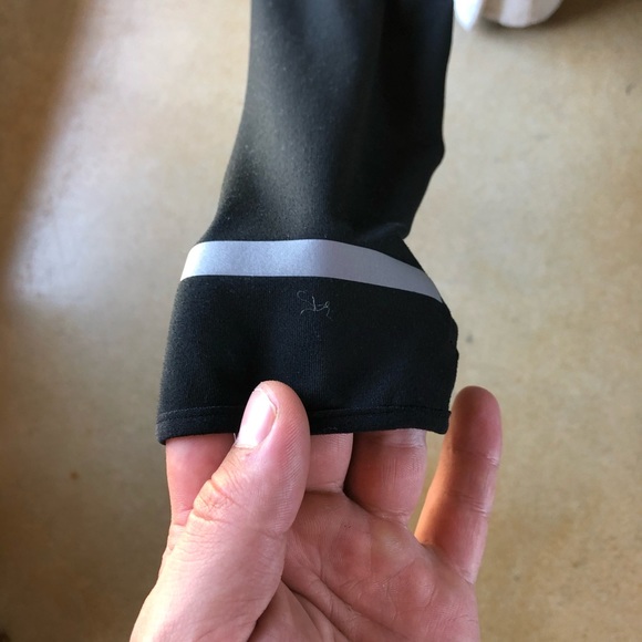 A Nike pull over with hood zippers and thumb holes - Picture 3 of 6